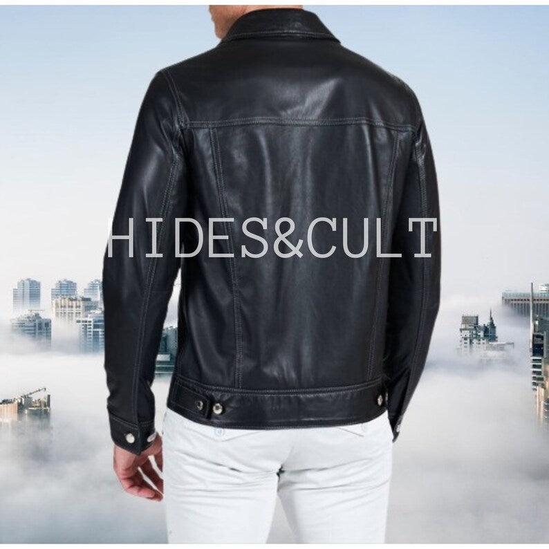Men's black leather trucker jacket, back view, showcasing clean design and prominent white contrast stitching.