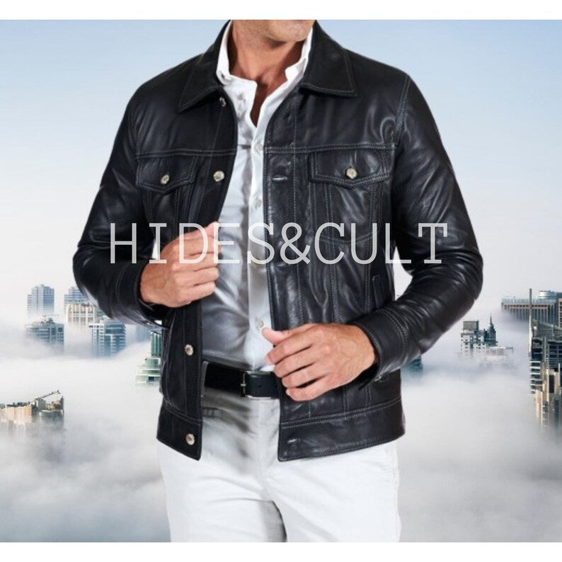 Black genuine leather trucker jacket for men, front view, featuring white stitching, button closure, and chest pockets.

