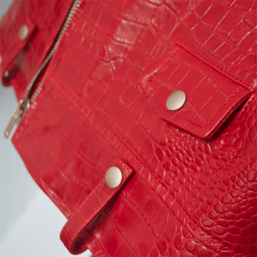 Close-up of the red croc-embossed effect on men's motorcycle biker leather jacket, highlighting the texture and premium leather craftsmanship, by Hides & Cult