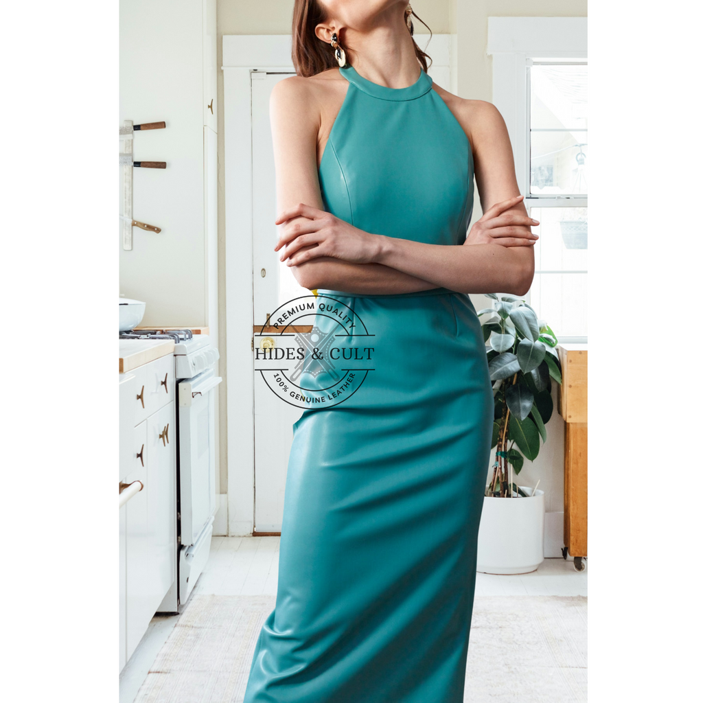 Close up of teal blue leather and halter neck detailing midi dress