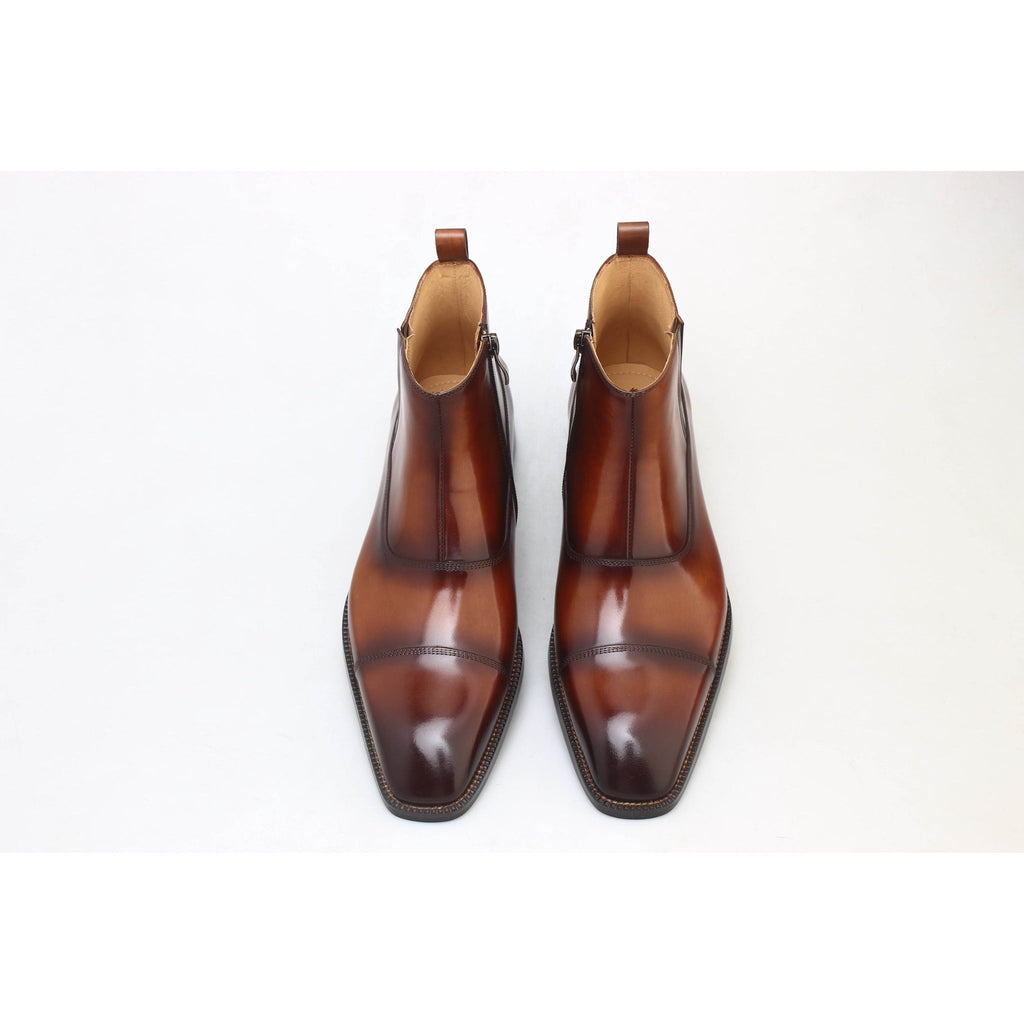 Top view of brown leather Chelsea boots for men – refined silhouette with hand-burnished finish and timeless appeal.