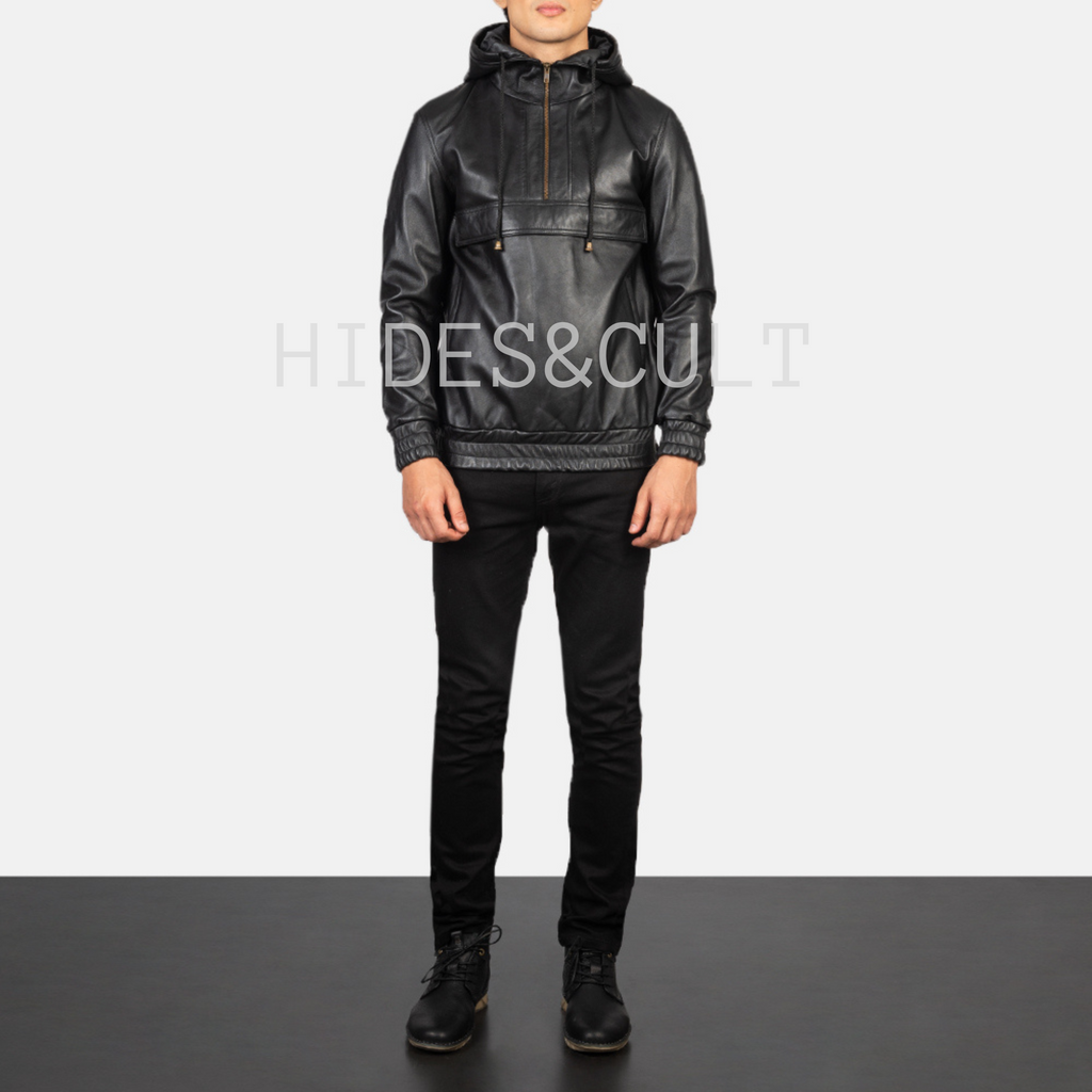Full-length shot of male model wearing black leather hoodie jacket and black pants, styled for urban streetwear by Hides & Cult.