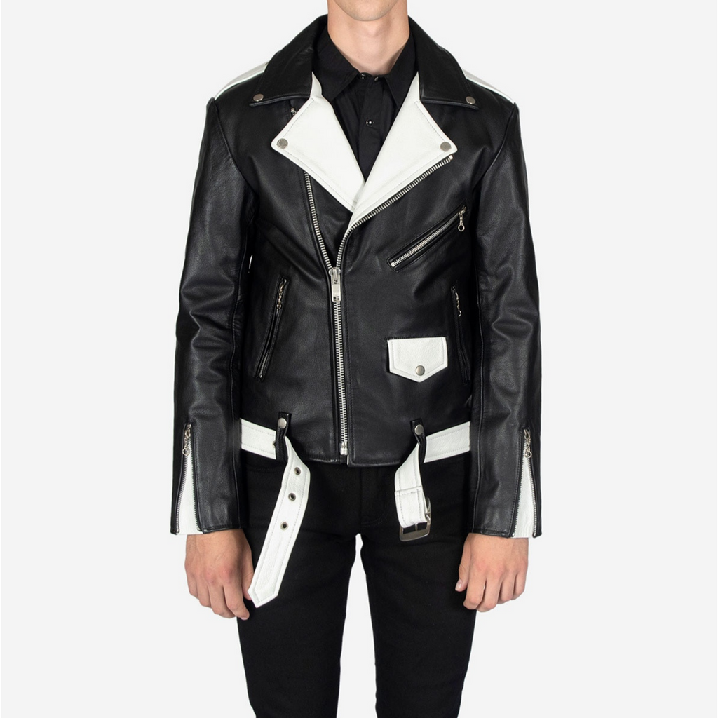 Full view of model wearing men's black and white two tone slim fit belted motorcycle leather jacket, showcasing complete outfit and fit