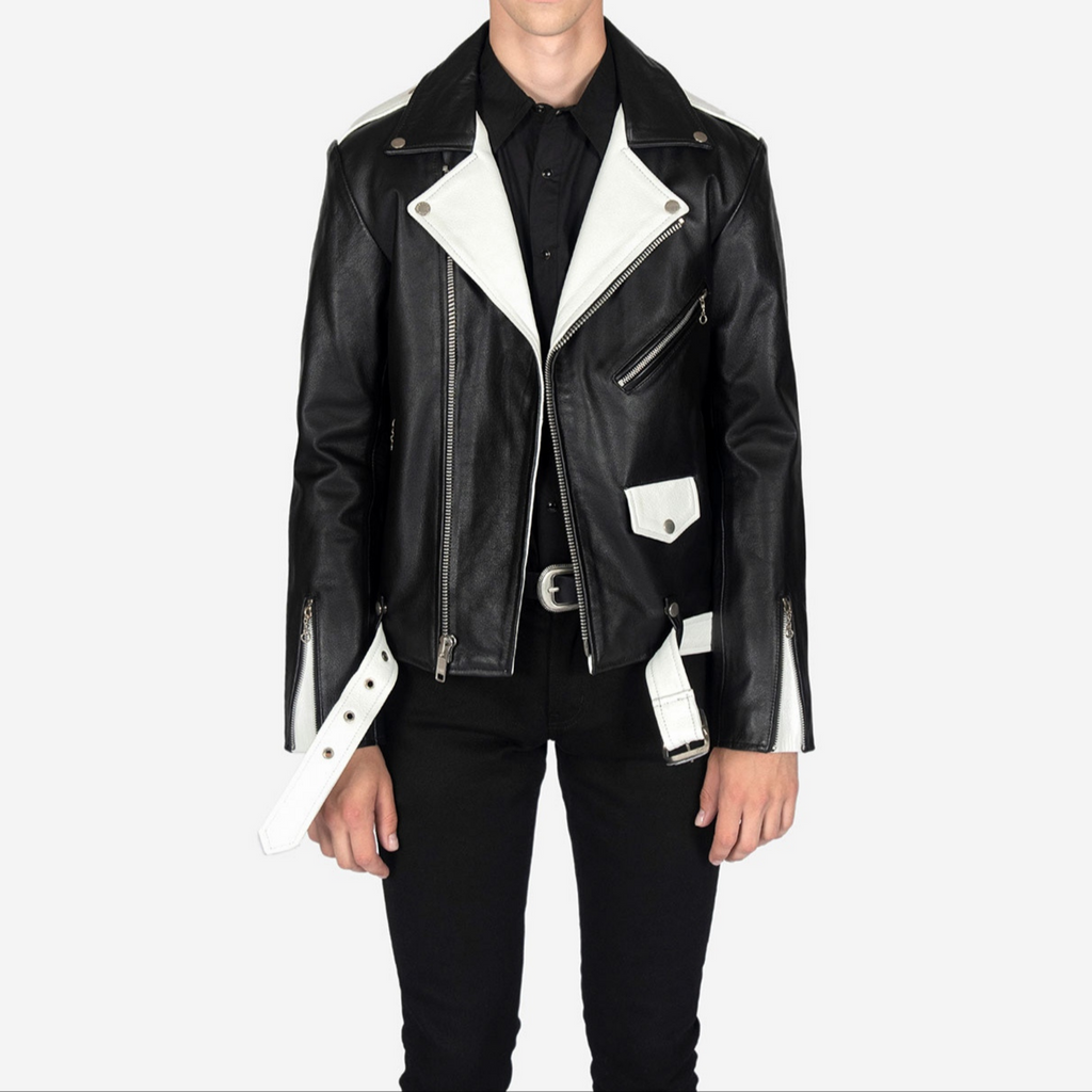 Full view of model wearing men's black and white two tone slim fit belted motorcycle leather jacket, showcasing complete outfit and fit in opened zip