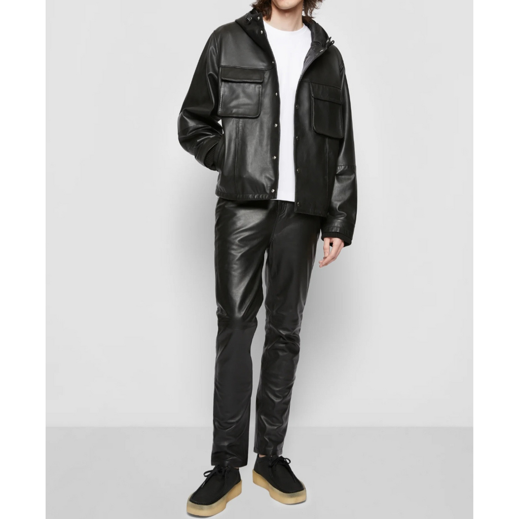Full view of model wearing men's black bomber style hooded genuine leather sweatshirt and leather pants, offering a sleek, modern look with premium leather craftsmanship – Hides & Cult.