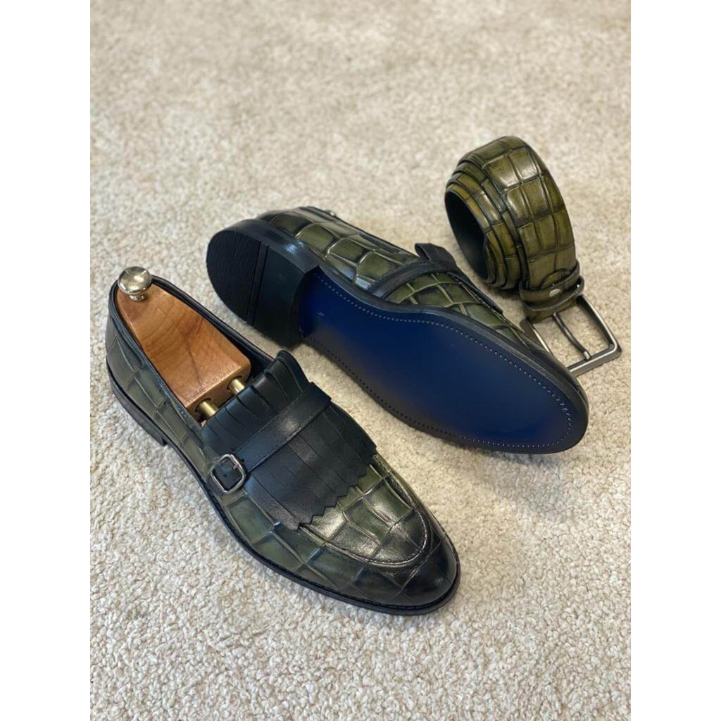 Luxury green leather loafers with monk strap and fringe detailing – a fashion-forward choice for men’s dress and evening wear.