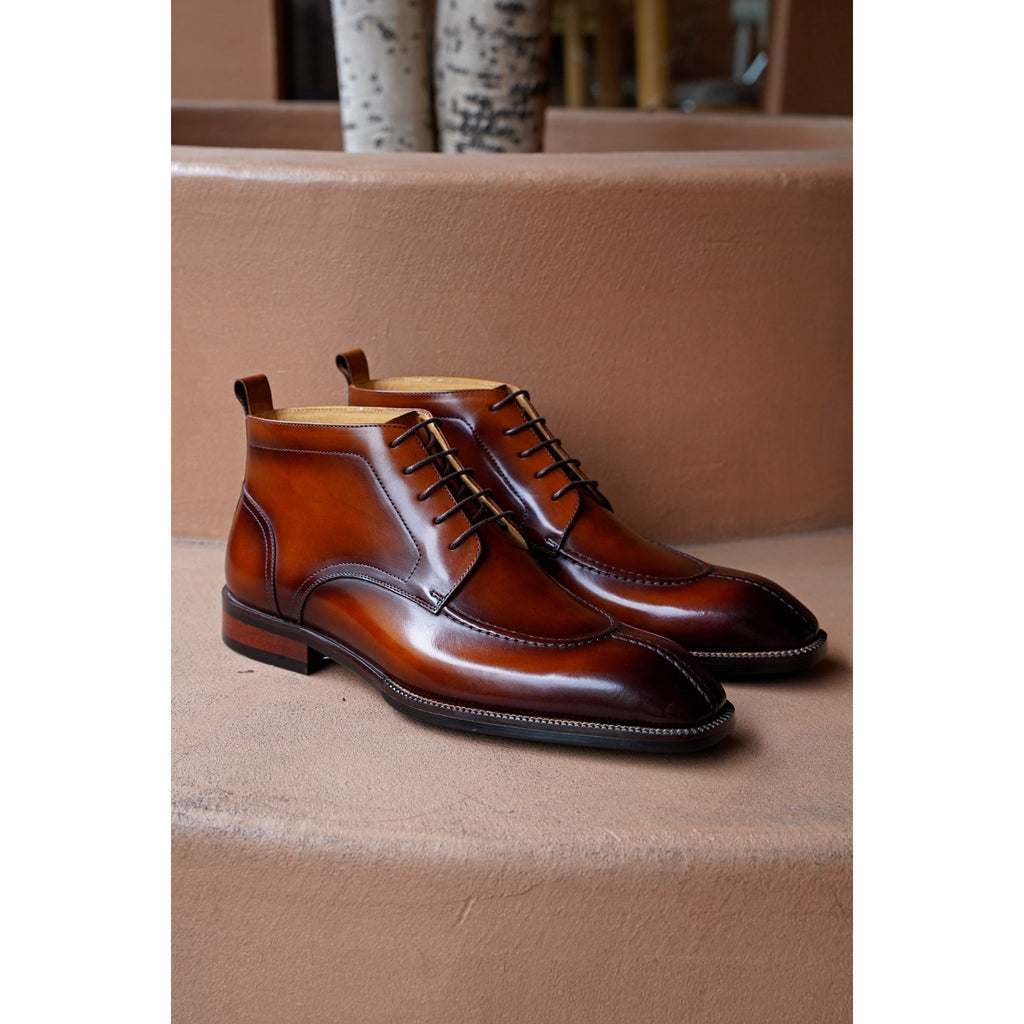 Top-quality brown leather formal boots displayed side by side – timeless design ideal for office and event styling.
