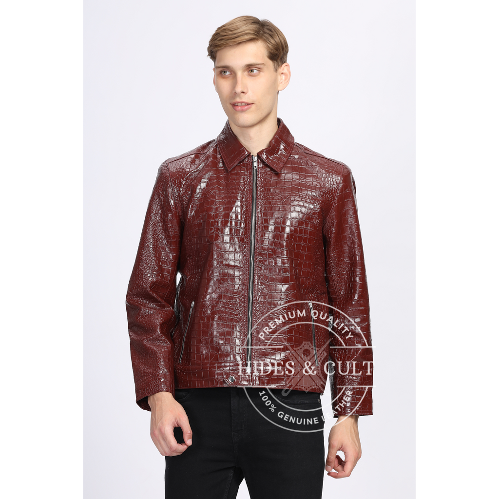 Male model wearing burgundy crocodile-textured genuine leather jacket by Hides & Cult, front view