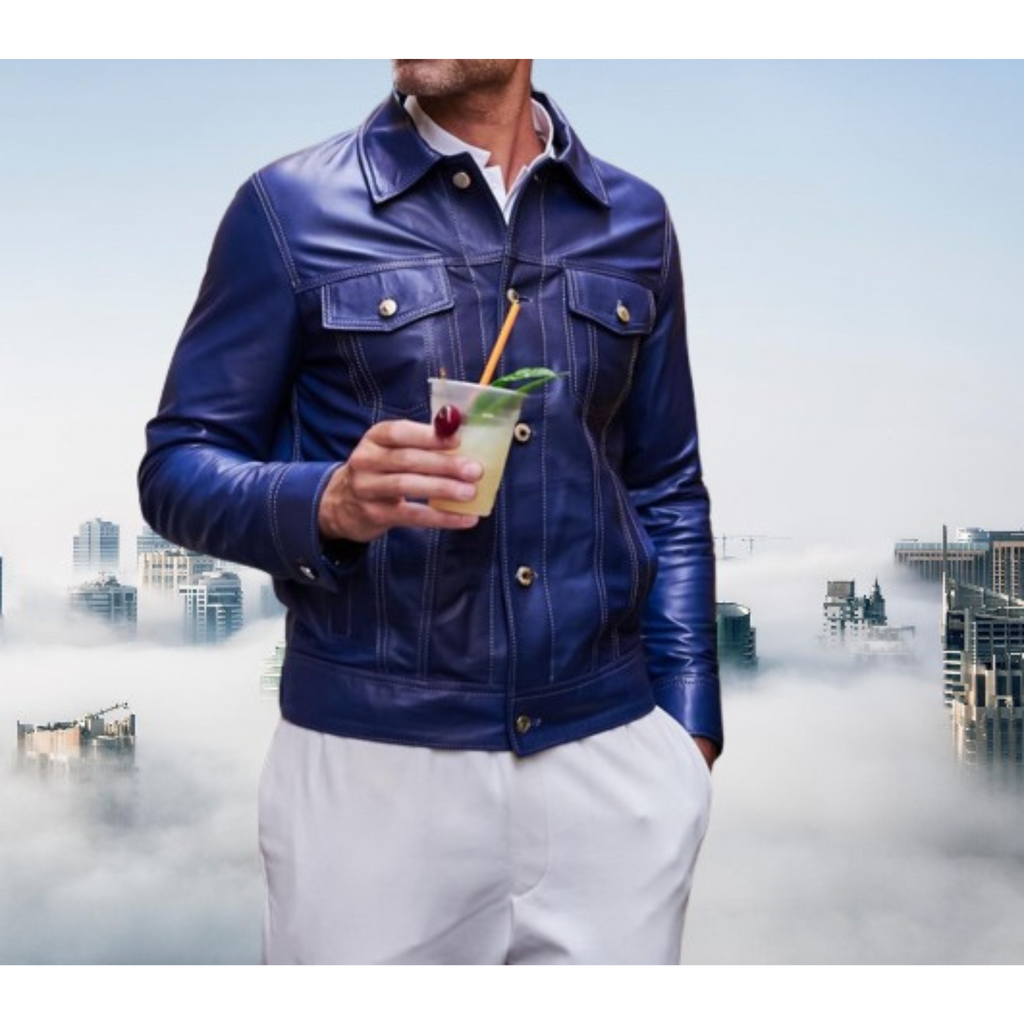 Men's classic Royal blue genuine leather trucker jacket from Hides & Cult, featuring white contrast stitching. Model with hands in pockets, showcasing fit and texture.

