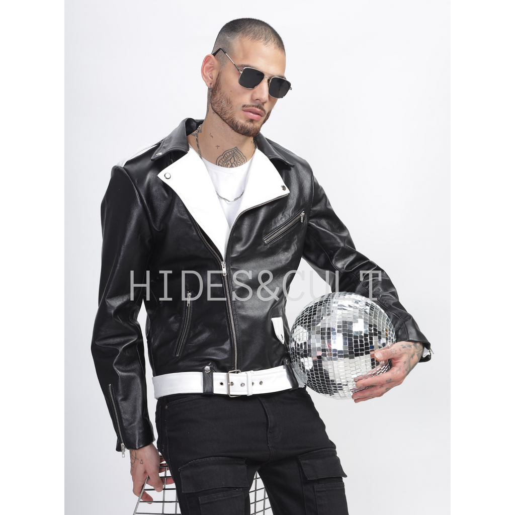 Model sitting wearing men's black and white two tone slim fit belted biker leather jacket, showcasing relaxed front view style