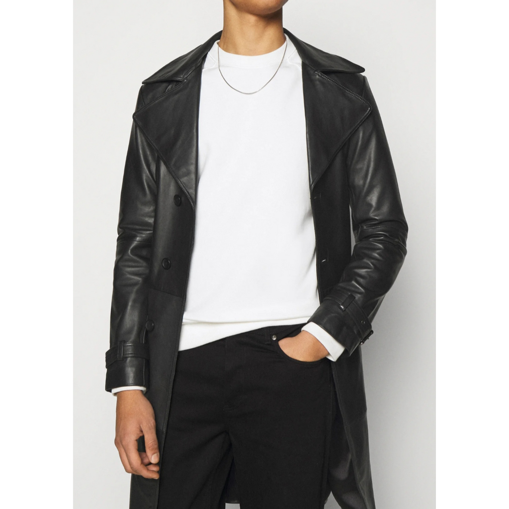 Model wearing men's black genuine leather trench coat open over outfit, showcasing interior lining and relaxed belted style