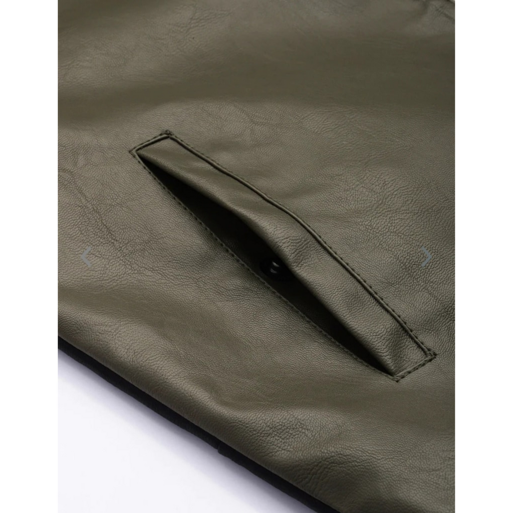 Overhead shot of  genuine leather jacket pocket details, showcasing material texture and design.

