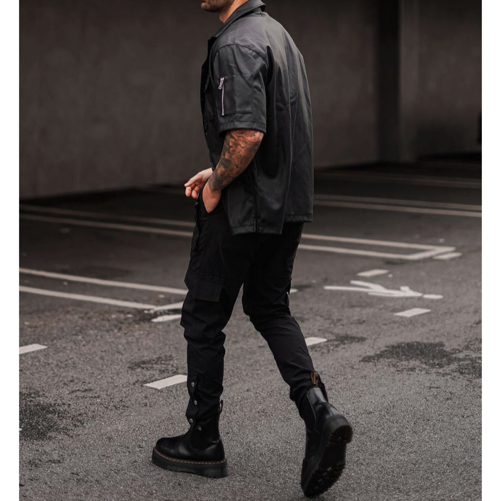 Side view of men's black genuine leather shirt, highlighting the perfect fit and high-quality leather texture – Hides & Cult.