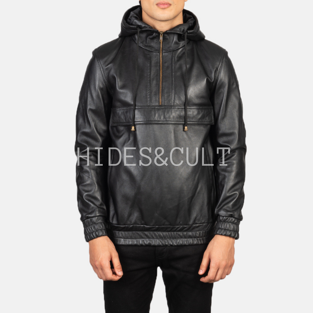 Straight front view of model wearing black leather hoodie jacket with front pocket, zipper, and drawstring hood from Hides & Cult.